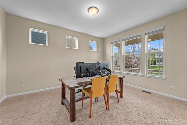 home office featuring baseboards, carpet, and visible vents