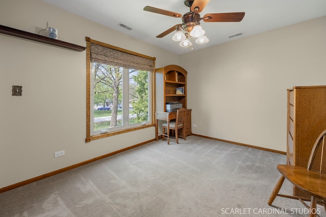 sitting room with baseboards, a ceiling fan, carpet flooring, and visible vents