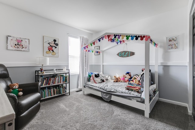 bedroom with baseboards and carpet
