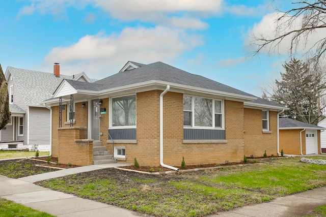 412 N Center Ave, Bradley, IL 60915 - view of front of home with brick siding and a shingled roof