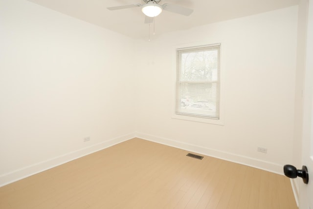 412 N Center Ave, Bradley, IL 60915 - spare room with light wood-type flooring, visible vents, baseboards, and ceiling fan