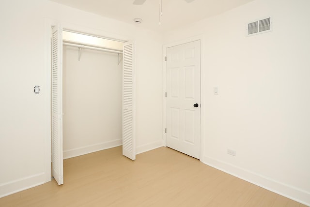 412 N Center Ave, Bradley, IL 60915 - unfurnished bedroom with light wood-style floors, a closet, a ceiling fan, visible vents, and baseboards