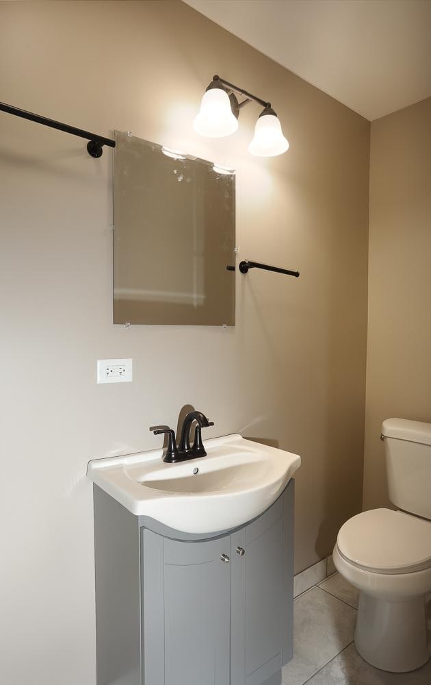 412 N Center Ave, Bradley, IL 60915 - bathroom with tile patterned floors, vanity, and toilet