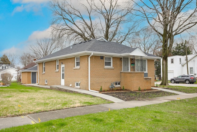 412 N Center Ave, Bradley, IL 60915 - view of property exterior featuring a yard and brick siding