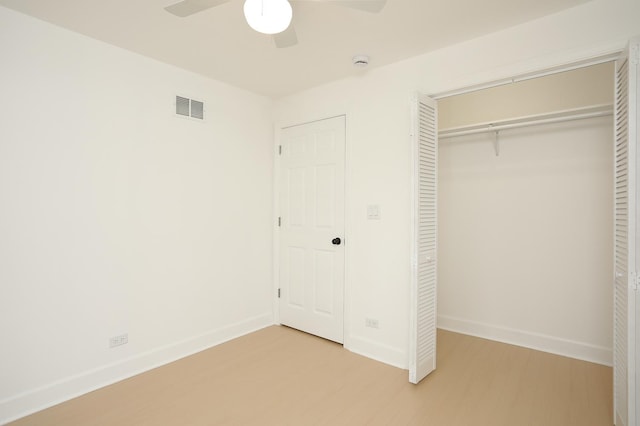 412 N Center Ave, Bradley, IL 60915 - unfurnished bedroom featuring visible vents, a closet, baseboards, and wood finished floors