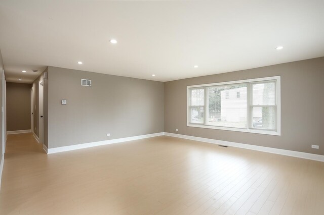 412 N Center Ave, Bradley, IL 60915 - empty room featuring light wood finished floors, baseboards, visible vents, and recessed lighting
