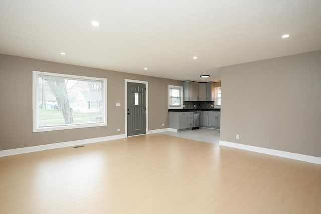 412 N Center Ave, Bradley, IL 60915 - unfurnished living room with baseboards, recessed lighting, and light wood finished floors
