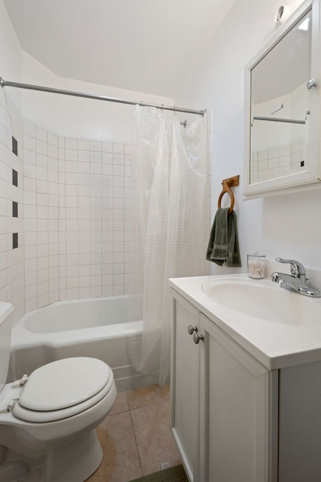 bathroom with toilet, vanity, tile patterned flooring, and shower / tub combo with curtain