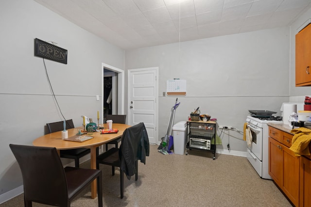 dining area featuring baseboards