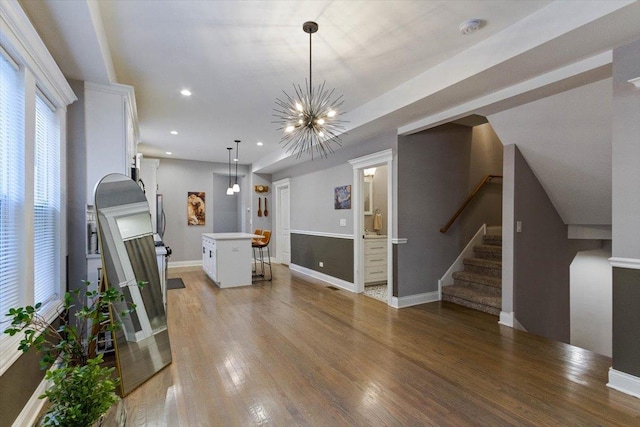 7614 S Chappel Ave, Chicago, IL 60649 - unfurnished living room featuring baseboards, light wood-type flooring, a chandelier, recessed lighting, and stairway