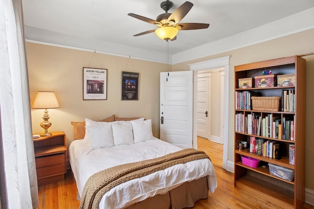 bedroom featuring ceiling fan and wood finished floors