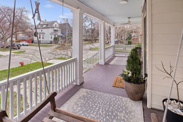 view of patio / terrace with a residential view and a porch