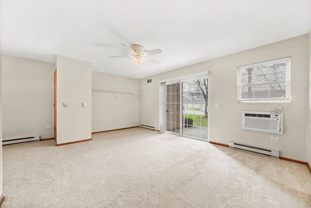 1520 W Sand Bar Ct Unit 1B, Round Lake Beach, IL 60073 - carpeted spare room with baseboards, a ceiling fan, and baseboard heating