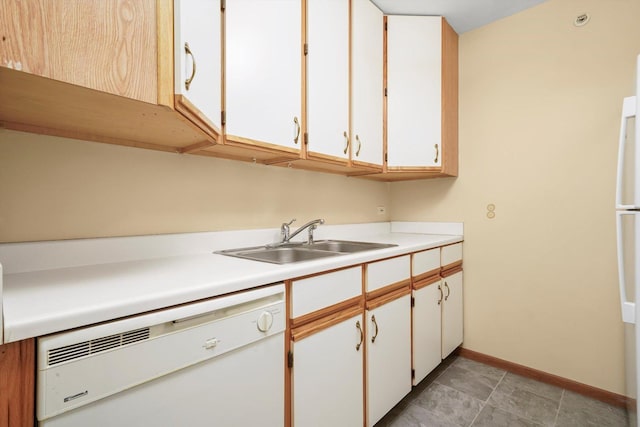 1520 W Sand Bar Ct Unit 1B, Round Lake Beach, IL 60073 - kitchen with white cabinets, white dishwasher, a sink, light countertops, and baseboards