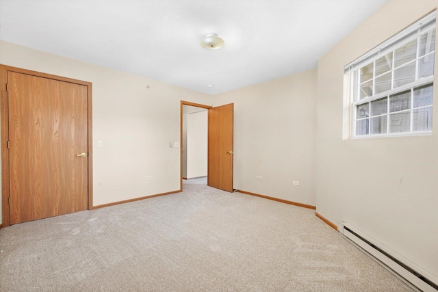 1520 W Sand Bar Ct Unit 1B, Round Lake Beach, IL 60073 - unfurnished bedroom with light colored carpet, baseboards, and a baseboard heating unit