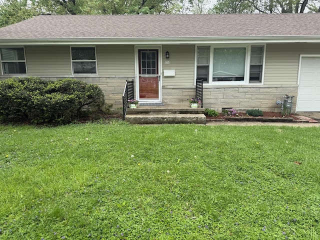 single story home with an attached garage, a front lawn, roof with shingles, and stone siding
