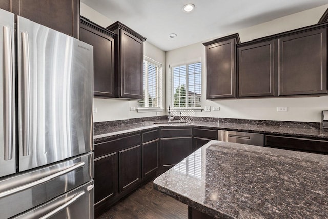 282 Willington Way, Oswego, IL 60543 - kitchen featuring stainless steel appliances, dark brown cabinetry, dark stone counters, dark wood-type flooring, and recessed lighting