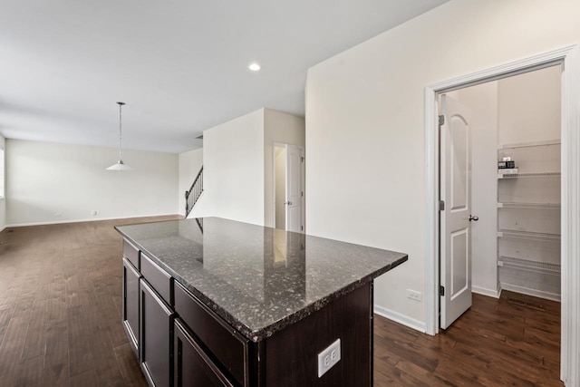 282 Willington Way, Oswego, IL 60543 - kitchen with dark wood finished floors, baseboards, dark brown cabinets, recessed lighting, and dark stone counters