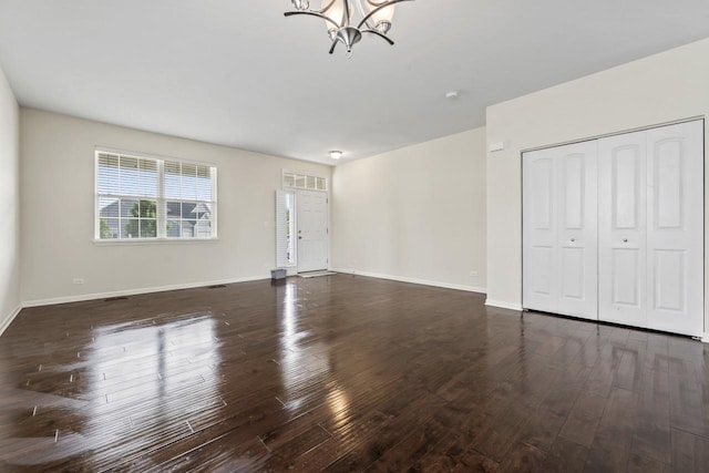 282 Willington Way, Oswego, IL 60543 - unfurnished living room with a chandelier, wood finished floors, and baseboards