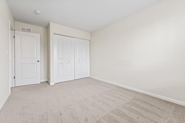 282 Willington Way, Oswego, IL 60543 - unfurnished bedroom with baseboards, carpet floors, and a closet