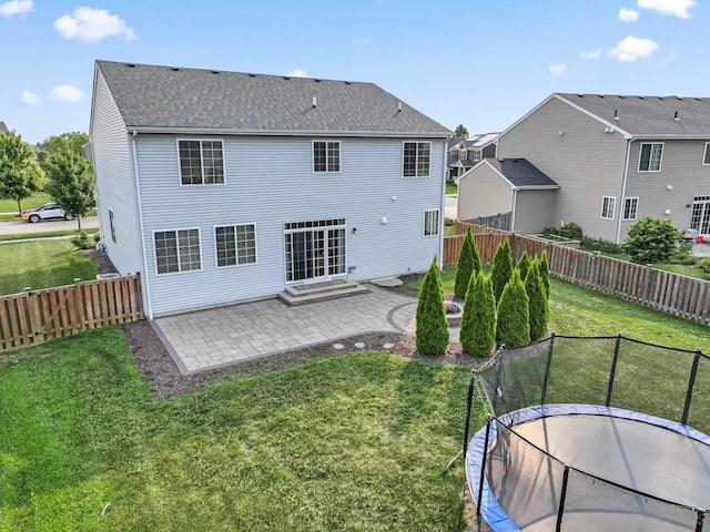 282 Willington Way, Oswego, IL 60543 - back of property featuring a patio, a trampoline, a shingled roof, a residential view, and entry steps