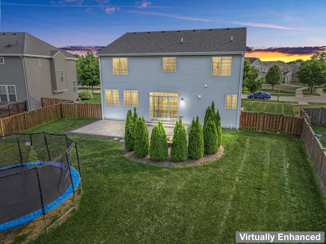 282 Willington Way, Oswego, IL 60543 - rear view of house featuring a trampoline, a patio, and roof with shingles