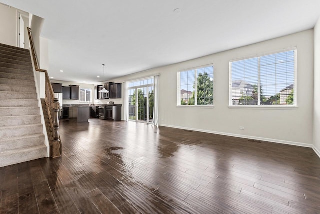 282 Willington Way, Oswego, IL 60543 - unfurnished living room with dark wood-type flooring, baseboards, stairway, and recessed lighting