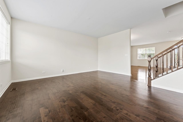 282 Willington Way, Oswego, IL 60543 - unfurnished room with dark wood-style flooring, stairway, and baseboards