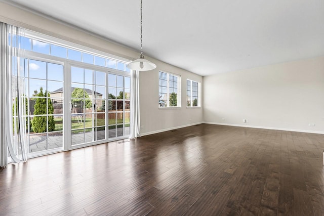 282 Willington Way, Oswego, IL 60543 - unfurnished dining area featuring dark wood-style flooring and baseboards