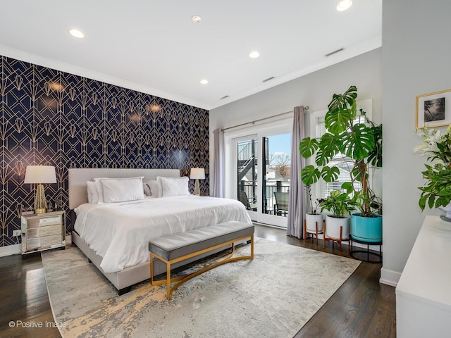 bedroom featuring an accent wall, access to outside, baseboards, recessed lighting, and dark wood finished floors