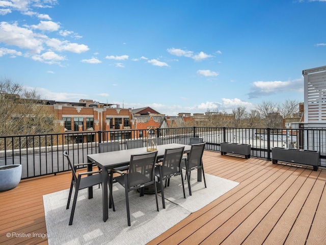 wooden deck featuring outdoor dining space