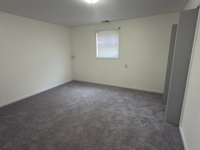392 Luella Ave, Calumet City, IL 60409 - spare room featuring carpet, visible vents, and baseboards