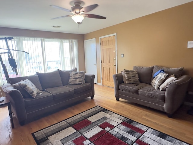 392 Luella Ave, Calumet City, IL 60409 - living area with visible vents, light wood-type flooring, and a ceiling fan