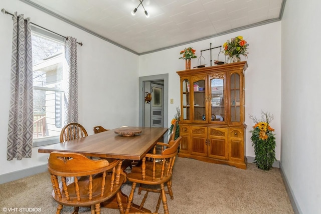 514 W Prairie St, Kirkland, IL 60146 - carpeted dining area with baseboards, ornamental molding, and plenty of natural light