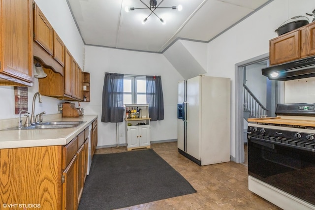 514 W Prairie St, Kirkland, IL 60146 - kitchen featuring gas range oven, white fridge with ice dispenser, light countertops, under cabinet range hood, and a sink
