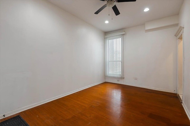 spare room with wood finished floors, baseboards, a ceiling fan, and recessed lighting