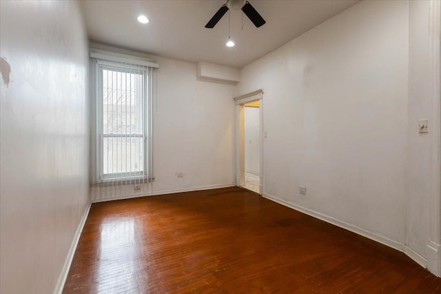 unfurnished room with ceiling fan, recessed lighting, hardwood / wood-style flooring, and baseboards