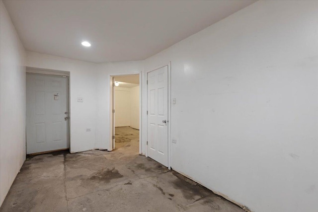 empty room featuring concrete flooring