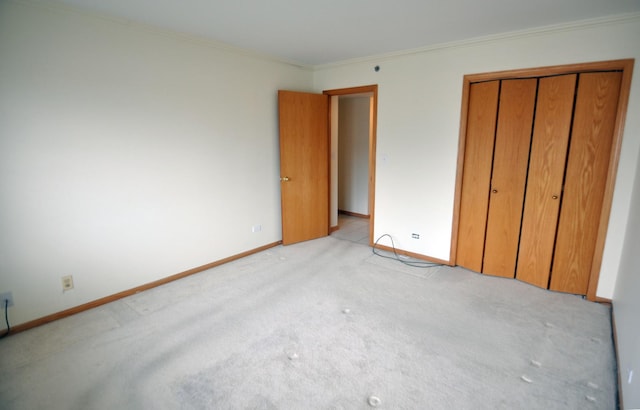 9514 S Kilbourn Ave Unit 3B, Oak Lawn, IL 60453 - unfurnished bedroom with crown molding, a closet, light colored carpet, and baseboards