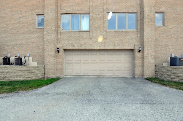 9514 S Kilbourn Ave Unit 3B, Oak Lawn, IL 60453 - garage with aphalt driveway and central air condition unit