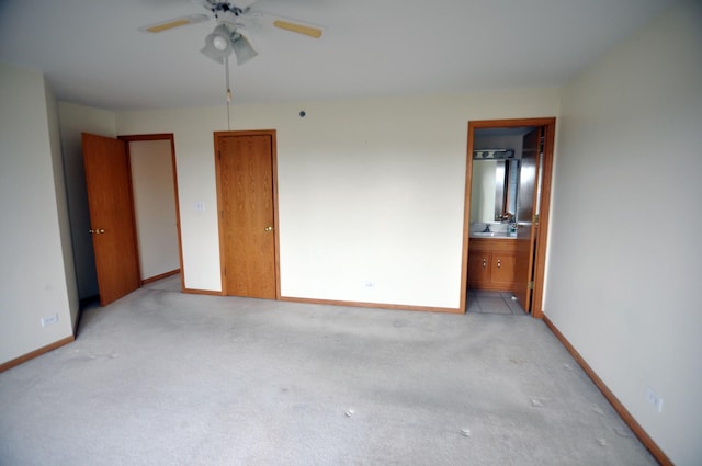 9514 S Kilbourn Ave Unit 3B, Oak Lawn, IL 60453 - unfurnished bedroom featuring baseboards, light colored carpet, a sink, and connected bathroom