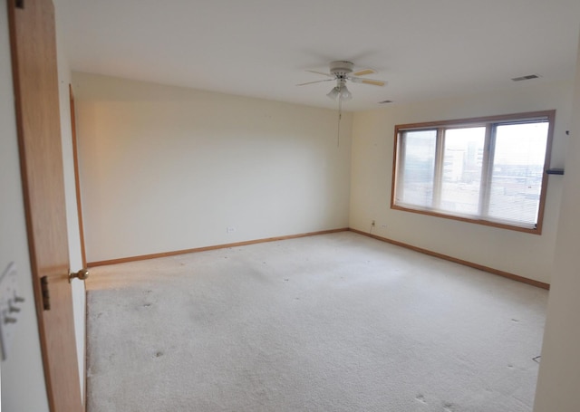 9514 S Kilbourn Ave Unit 3B, Oak Lawn, IL 60453 - unfurnished room with light carpet, visible vents, baseboards, and ceiling fan