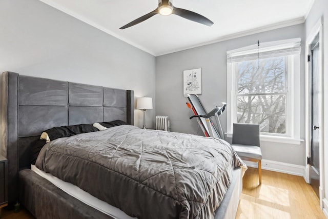 1606 W Winona St Unit 3, Chicago, IL 60640 - bedroom with baseboards, crown molding, radiator, and wood finished floors