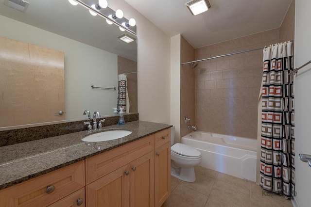 bathroom with vanity, visible vents, toilet, tile patterned floors, and shower / bath combo with shower curtain