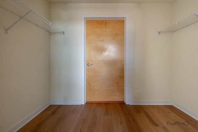 spacious closet with wood finished floors