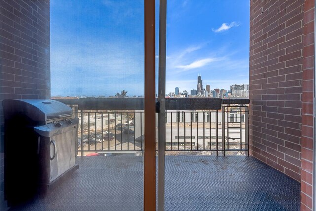 balcony featuring grilling area and a view of city