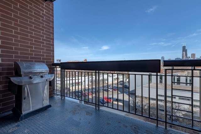 balcony with a grill and a city view