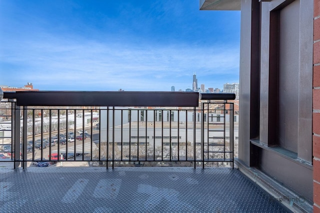 view of gate with a city view
