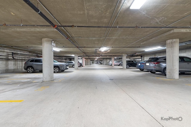 parking garage featuring a garage door opener