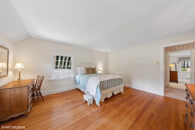 3916 Franklin Ave, Western Springs, IL 60558 - bedroom with light wood finished floors, baseboards, and vaulted ceiling
